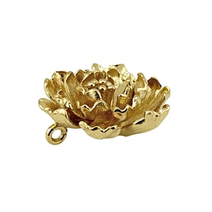 May include: A gold-colored peony flower charm with detailed petals and a small loop for attaching to jewelry. The charm is made of a shiny, metallic material and is set against a white background.