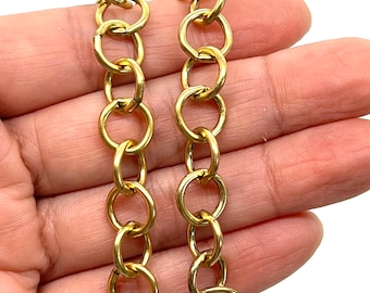 May include: Two strands of gold chain with round links. The chain is approximately 18 inches long.
