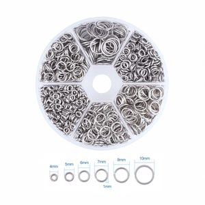 May include: A clear plastic organizer filled with various sizes of silver-colored jump rings. The rings range from 4mm to 10mm in diameter, with a thickness of 1mm. Ideal for jewelry making and crafting projects.