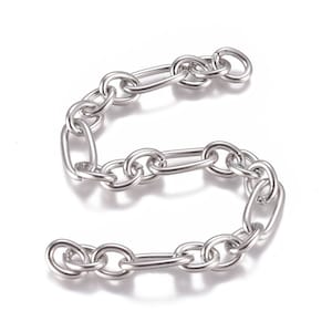 May include: A silver chain necklace with oval links. The chain is made of metal and has a polished finish.