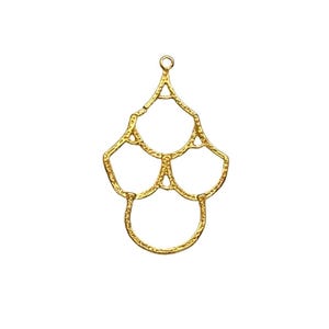 May include: A gold-colored metal pendant with an openwork design. The pendant features a series of connected, rounded shapes, with a small loop at the top for hanging. The overall shape is reminiscent of a stylized flower or decorative element.