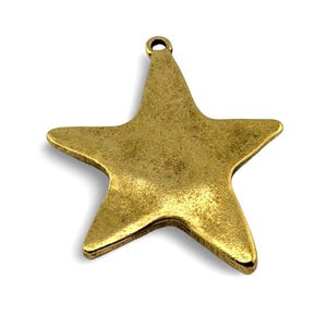 May include: A bronze-colored star-shaped charm with a loop at the top for hanging. The charm has a textured surface and a vintage aesthetic. The star is a classic shape, suitable for jewelry or craft projects.