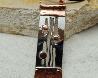 Iron and copper pendant