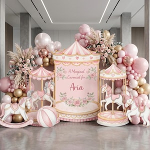 May include: A pink and white carousel-themed party backdrop featuring the text A Magical Carousel for Aria, surrounded by a large balloon arch in shades of pink, gold, and white, with floral accents and three white carousel horse figures.