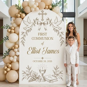 May include: A large arched sign for a First Communion featuring gold text and illustrations of a cross, doves, a chalice, and grapes. The sign reads "FIRST COMMUNION of Elliot James OCTOBER 24, 2026" and is decorated with beige and gold balloons.