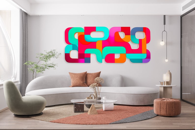 May include: A modern living room with a white curved sofa, a round coffee table, and a colorful abstract wall art piece. The art piece is made of geometric shapes in shades of red, orange, yellow, green, blue, and purple.