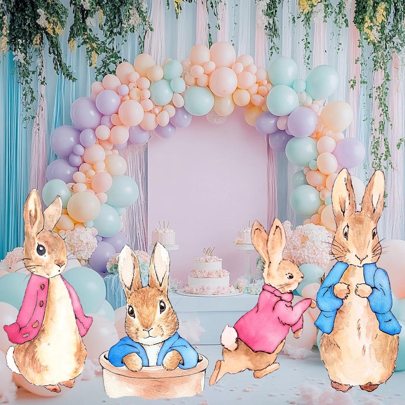 May include: Four brown rabbit figurines with different colored clothing. The rabbits are standing in front of a pastel pink background with a balloon arch made of pastel colored balloons.