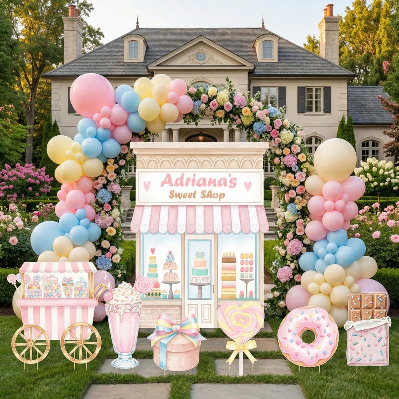 May include: A decorative sweet shop display featuring a pastel balloon arch, a candy cart, a milkshake, a gift box, a heart-shaped lollipop, a donut, and a chocolate bar. The central structure is labeled Adriana's Sweet Shop in pink text.