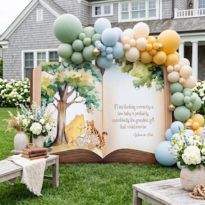 May include: A large open book prop featuring a watercolor illustration of Winnie the Pooh and Tigger, with the text: If I am thinking correctly, a new baby is probably, undoubtedly the grandest gift that could ever be. Winnie the Pooh. Balloon arch.