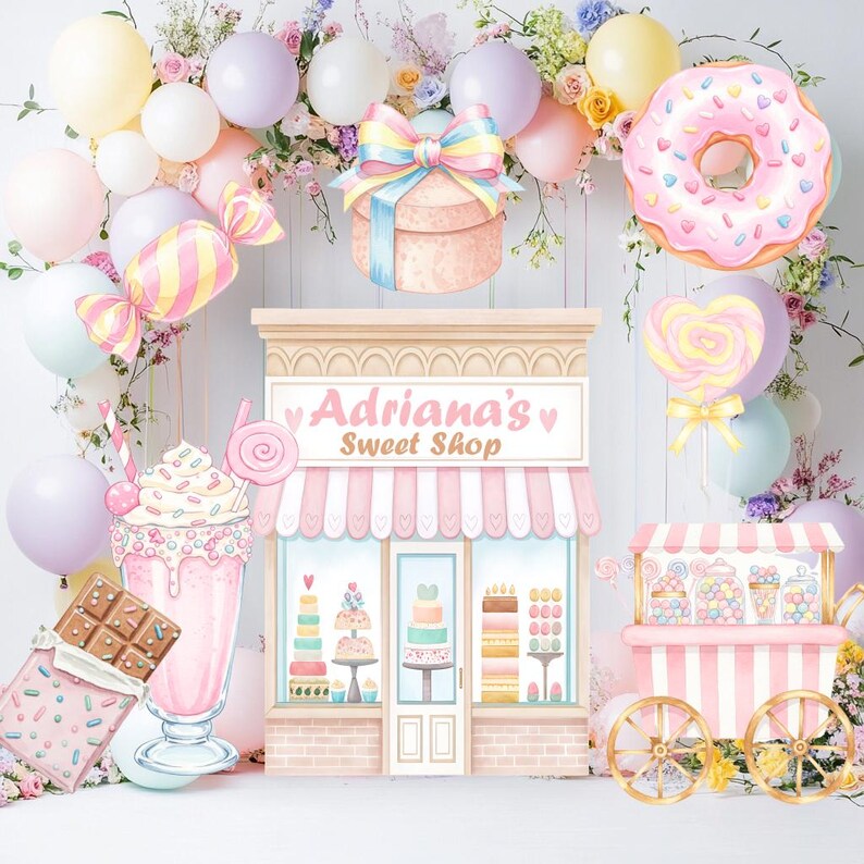 May include: A backdrop featuring a sweet shop storefront labeled 'Adriana's Sweet Shop' surrounded by pastel balloons, a pink donut, a milkshake, a chocolate bar, a candy cart, and floral arrangements in shades of pink, yellow, and lavender.