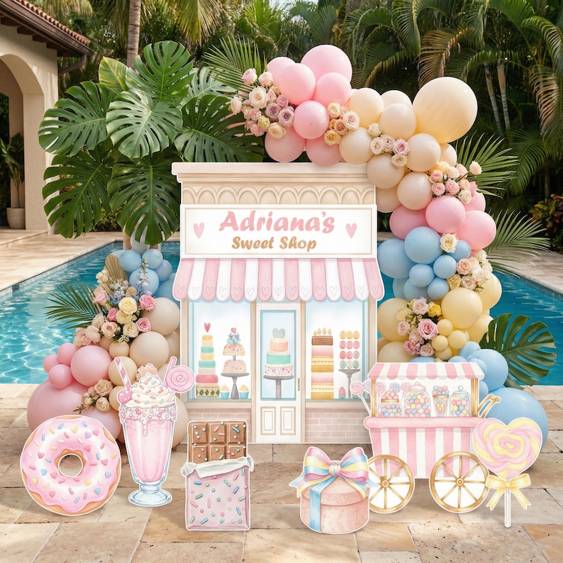 May include: A party backdrop featuring a storefront sign reading Adriana's Sweet Shop, surrounded by a balloon arch in pink, blue, and cream. Cutouts include a frosted donut, a milkshake, a chocolate bar, a gift box, and a candy cart.