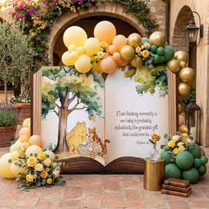 May include: A large open book display featuring a watercolor illustration of Winnie the Pooh and Tigger with the text, If I am thinking correctly, a new baby is probably, undoubtedly the grandest gift that could ever be. Decorated with yellow, peach, and green balloons and floral arrangements.