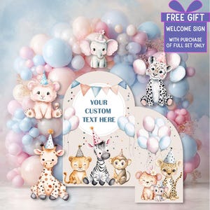 May include: A pastel-colored party decoration set featuring watercolor illustrations of safari animals, balloons, and a banner. The set includes a welcome sign and space for custom text. The animals include a giraffe, lion, zebra, monkey, leopard, and elephant.