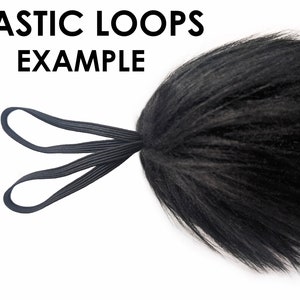 May include: Black faux fur tail with two black elastic loops attached. The text "ELASTIC LOOPS EXAMPLE" is visible above the tail.
