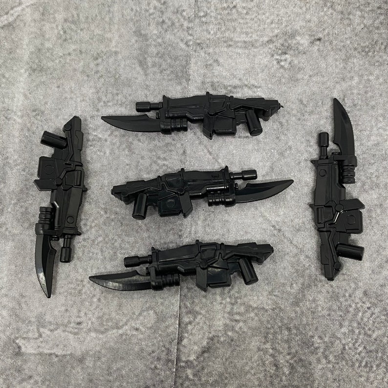 May include: Five black plastic toy weapons, including a rifle, a pistol, and three swords. The weapons are all detailed and realistic.