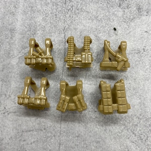 May include: Six tan-colored tactical vests with various designs. The vests have pouches, straps, and other details. The vests are arranged on a textured gray surface.