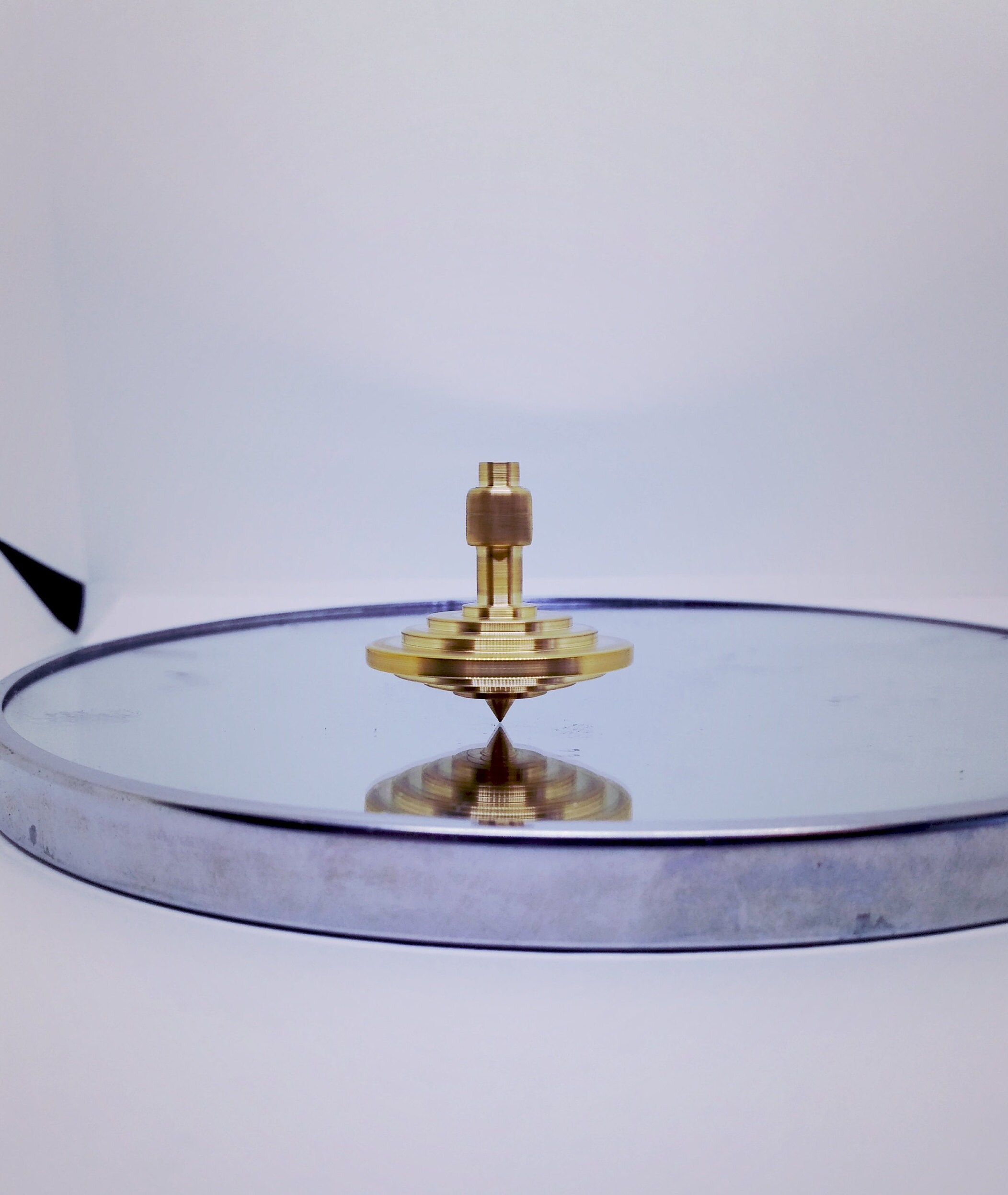 brass spinning top
