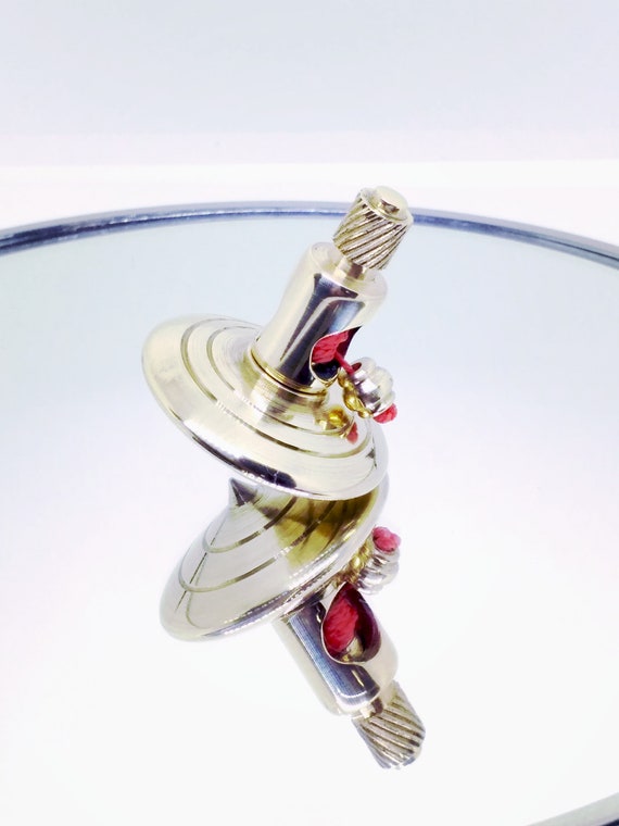 brass spinning top