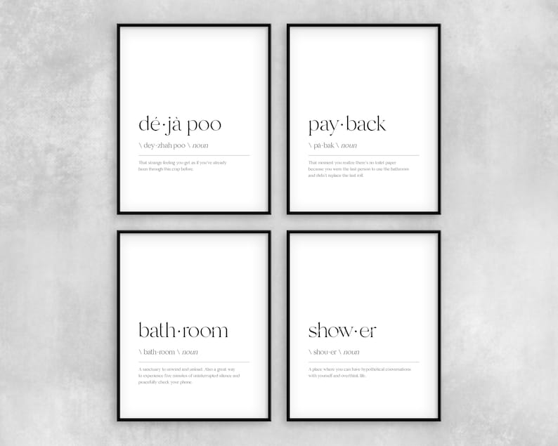 May include: Four black framed prints with white backgrounds and black text. The prints are definitions for the words "d&eacute;j&agrave; poo", "pay-back", "bath-room", and "show-er".