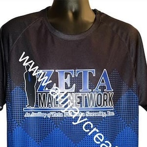 May include: Black and blue t-shirt with the text "ZETA MALE NETWORK" in white and blue. The shirt has a blue geometric pattern that fades into a solid blue color at the bottom. The shirt is displayed on a mannequin.