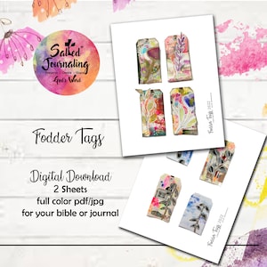 May include: Two sheets of digital printable tags with a watercolor and mixed media design. The tags feature floral and botanical elements with a distressed, vintage look. The text "Fodder Tags 2022" appears on each sheet.