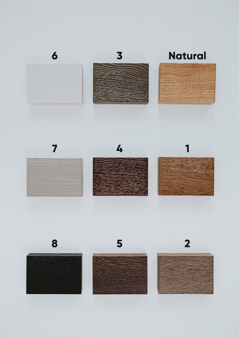May include: Nine wood samples in different colors and finishes, labeled with numbers 1 through 8 and the word "Natural".