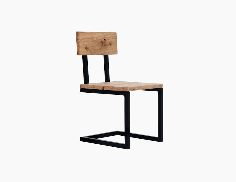 May include: A black metal chair with a wooden seat and backrest. The chair has a unique design with a curved metal frame.