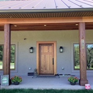 Vertical Brass 4 Number Address Plaque shown on customer home
