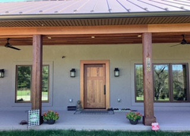 Vertical Brass 4 Number Address Plaque shown on customer home