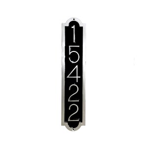 May include: A vertical silver plaque with a black background and the numbers 15422 in white.