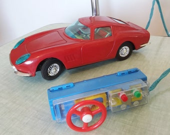 Rare toy old sheet metal 1960 car FERRARI 275 GT. Remote control . Original toy. Made in japan