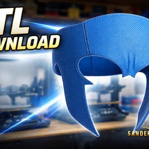Puede incluir: Un casco azul estilo superhéroe con una superficie texturizada. La imagen incluye el texto "STL DOWNLOAD" y el logotipo de Sander Props. El casco tiene un diseño puntiagudo distintivo en los lados y es probablemente un modelo imprimible en 3D.