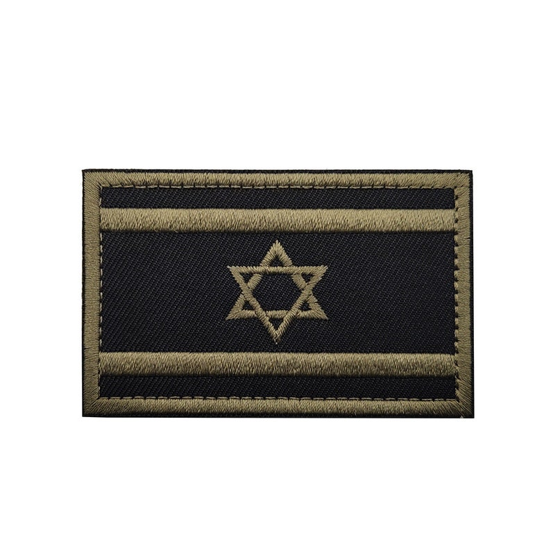 May include: A black and olive green embroidered patch featuring the Israeli flag. The flag has two horizontal olive green stripes and a six-pointed star in the center.