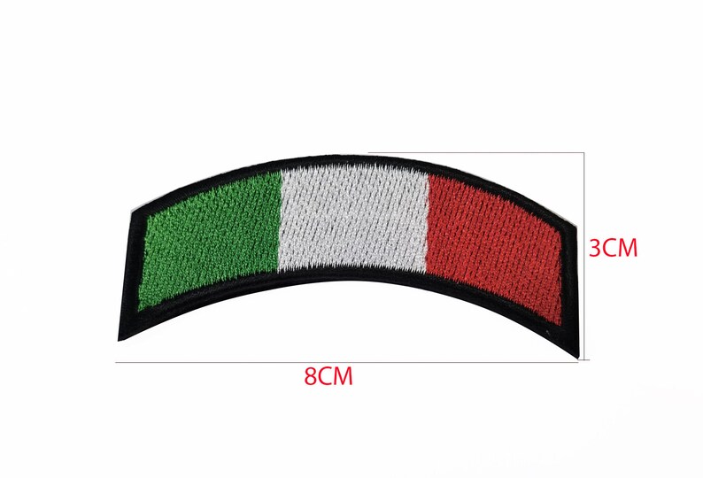 May include: An embroidered Italian flag patch in the shape of a curved rectangle. The patch is green, white, and red with black stitching around the edges. The patch measures 8 inches wide and 3 inches tall.