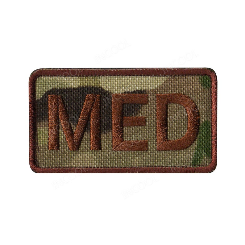 May include: A brown embroidered patch with the word "MED" in a camouflage pattern.