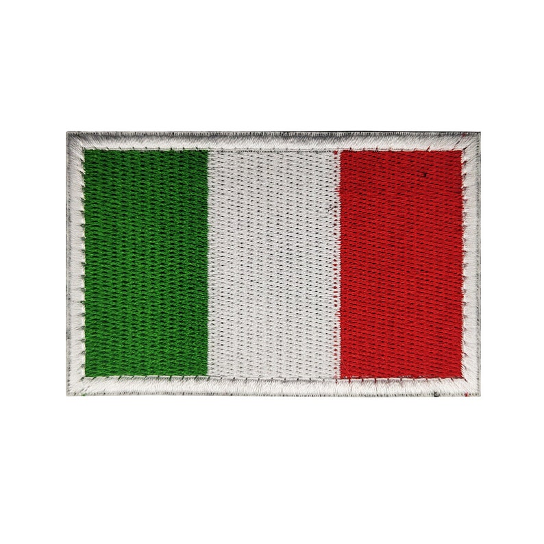May include: An embroidered Italian flag patch with a white border. The flag is green, white, and red.