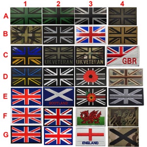 Könnte beinhalten: Ein Set mit 28 Bügelbildern mit verschiedenen Variationen der Union Jack Flagge. Die Patches beinhalten eine Vielzahl von Farben, Designs und Symbolen, darunter die Wörter "UK Veteran", "GBR", "Scotland", "Wales" und "England".
