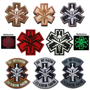 May include: A set of ten embroidered patches featuring a medical symbol with a Spartan helmet and crossed swords. The patches are in various colors, including brown, tan, gray, red, white, and green. Some patches are reflective and glow in the dark. The patches have the text "Do No Harm" and "Do Know Harm" around the edges.