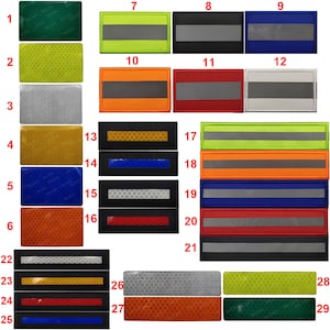 Op de afbeelding: Een set van 29 reflecterende patches in verschillende kleuren en patronen, waaronder groen, geel, oranje, rood, blauw, zwart en wit. De patches zijn genummerd van 1 tot en met 29.