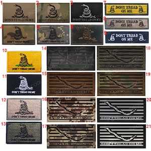 Puede incluir: Un conjunto de 21 parches termoadhesivos con la bandera de Gadsden 'Don't Tread on Me' con una serpiente de cascabel. Los parches son de varios colores y patrones, incluyendo camuflaje, negro, blanco y amarillo. Los parches son todos rectangulares y tienen un borde cosido.
