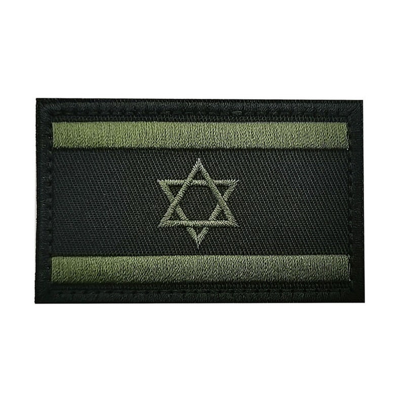 May include: A black and green embroidered patch featuring the Star of David, a symbol of Judaism. The patch has a black background with two green stripes at the top and bottom.
