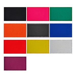 May include: Nine fabric swatches in different colours. The swatches are arranged in three rows of three. The colours are black, pink, green, orange, grey, blue, red, yellow, and grey.