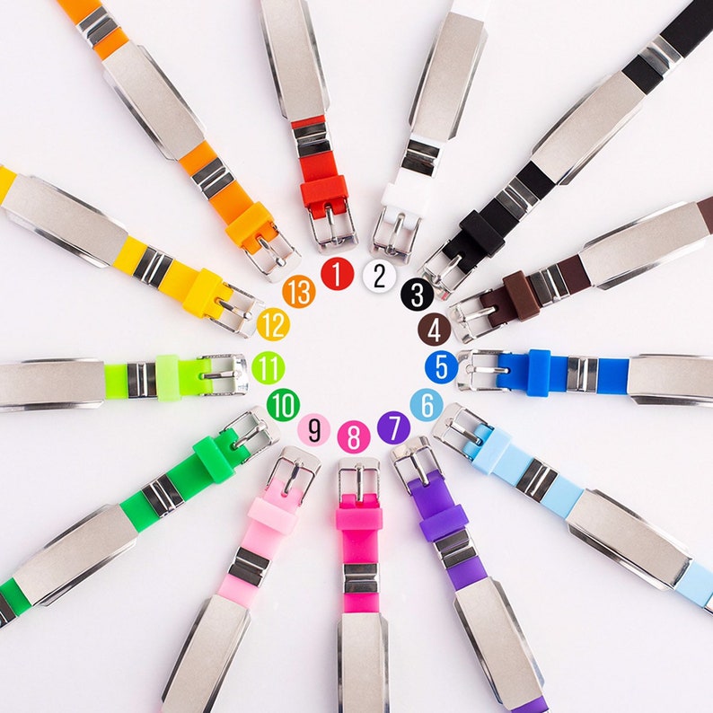 May include: Twelve colorful silicone bracelets with silver metal plates, each with a number from 1 to 12 printed on it.