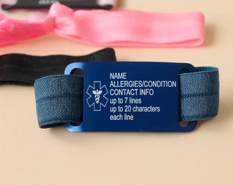 May include: A blue medical alert bracelet with a rectangular metal plate featuring a white Star of Life symbol and text that reads NAME, ALLERGIES/CONDITION, CONTACT INFO, up to 7 lines, up to 20 characters each line, attached to a blue elastic band.