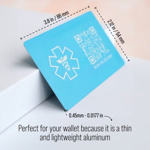 May include: A light blue metal card with a white star of life symbol and a QR code. The card is 3.8 inches by 2.12 inches and 0.0177 inches thick. The text "SCAN THE CODE" is printed below the QR code.