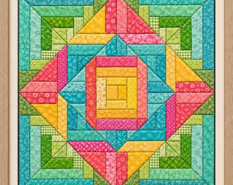 Puede incluir: Un edredón de pared cuadrado con un patrón geométrico de cabaña de troncos, con un cuadrado central amarillo rodeado por capas concéntricas de tiras de tela en tonos rosa, amarillo, turquesa y verde, todo dentro de un marco de madera clara.