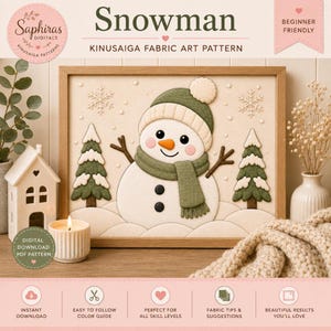 May include: A digital Kinusaiga fabric art pattern titled Snowman featuring a central snowman with a green hat and scarf, two green pine trees, and snowflakes. The design includes text labels for beginner friendly and digital download PDF pattern.