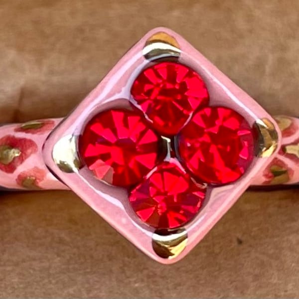 Size 8.25 Light Pink, Navy Blue and Red ceramic ring with 22kt gold accents and bright red glass rhinestones.