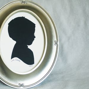 Multiple Custom child silhouettes handmade from cut paper