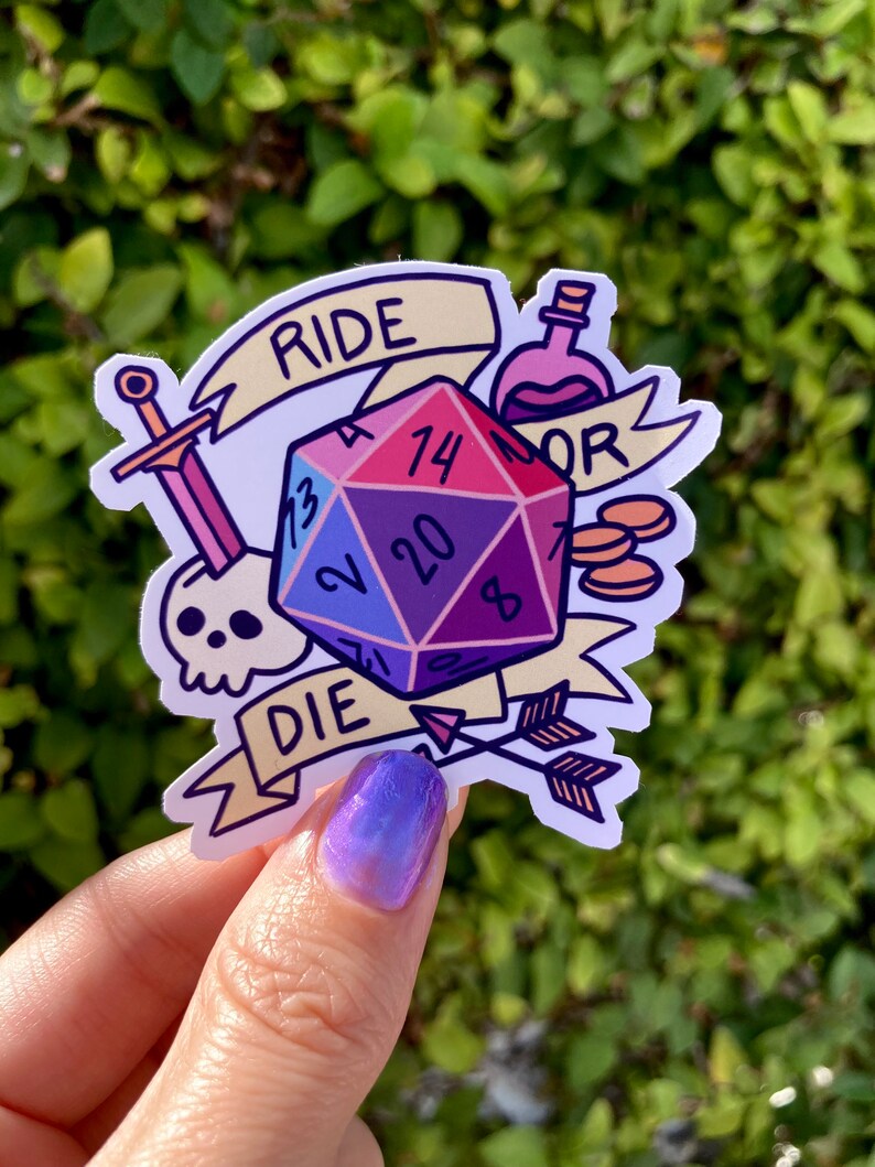 May include: A sticker featuring a multi-colored 20-sided die with the numbers 13, 2, 20, 7, 14, and 8. The die is surrounded by a sword, a skull, a potion bottle, two gold coins, and a banner that reads "Ride or Die".
